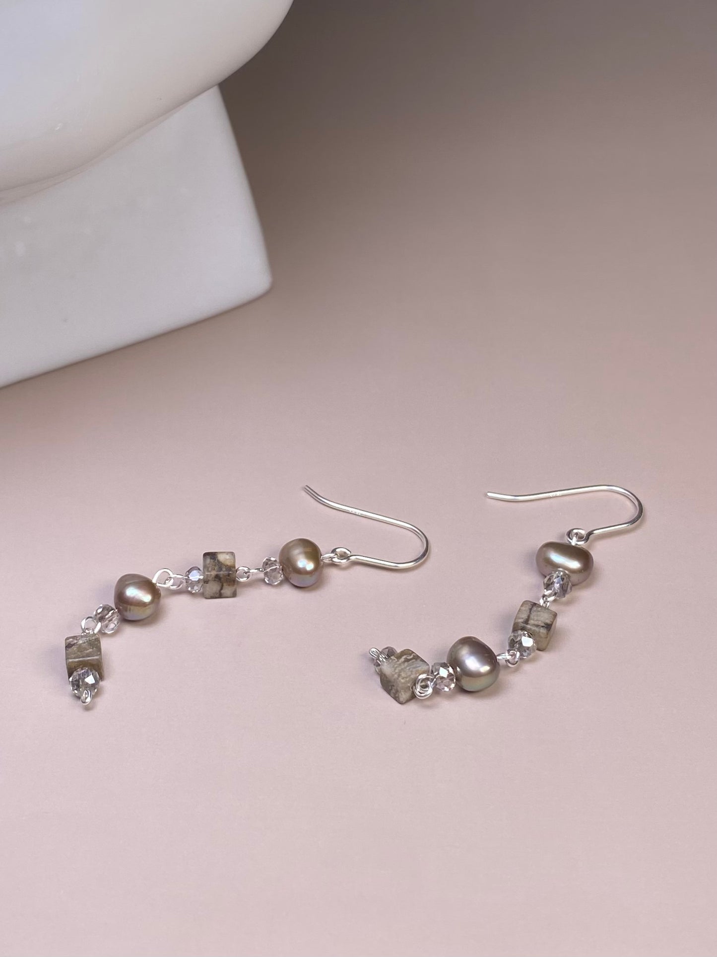 Veronica Pearl & Zebra Earrings featuring 6mm silver pearls, brown zebra cube 4mm beads, and 2-toned silver 3mm beads. Stylish 925 sterling silver hooks and wire complete the design, placed sparkling at the center.